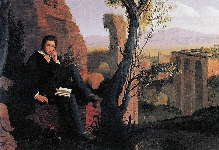El poeta Percy B. Shelley está sentado en posición pensativa con un libro y una pluma en Roma.